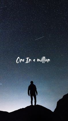 a man standing on top of a hill under a night sky with the words, one in a million