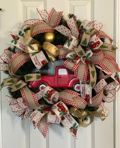 a christmas wreath with a red truck on it