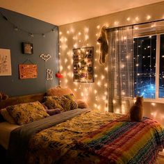 a cat sitting on top of a bed in a room with string lights strung across the walls