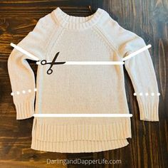 an image of a sweater with scissors cut out the front and side lines on it