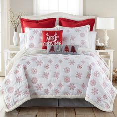 The Red Snowflake Sherpa Reversible King Quilt Set by Levtex Home is inspired by a traditional winter lodge. Offered in red and white, this design will immediately transform your bedroom. Made with the softest pre-washed cotton, this reversible quilt features a pattern of red snowflakes embroidered on an off-white ground, reversing to a cream solid microfiber back and edged with a soft, cozy sherpa. The King Quilt Set is machine washable and includes the quilt (106x92in.) and two pillow shams (3 Festive Bedding, Snowflake Quilt, Fleece Quilt, King Quilt Sets, Cotton Quilt Set, Red Snowflake, Christmas Bedding, Christmas Decorations Bedroom, Holiday Quilts