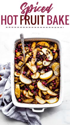 a casserole dish filled with apples, cranberries and other toppings