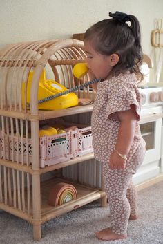 Display your little one's favorite books and toys. Montessori-style shelves make it easy for them to reach! Made of sustainably sourced and renewable rattanCoated in a natural water-based finishHeight: 28.0"Width: 16.0"Depth: 12.0"Final Sale Item Kids Room Toy Storage Baby, Kids Montessori Shelf, Shelf Measurements, Rattan Shelf, Montessori Bookshelf, Rattan Cabinet, Montessori Shelf, Montessori Playroom, Play Kitchens