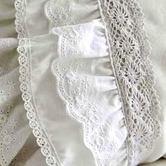 an image of white pillows with lace on them