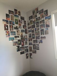 a room with pictures on the wall and a bed