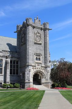 a large castle like building with a clock on it's side