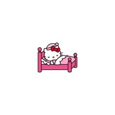 a hello kitty sitting on top of a pink bed