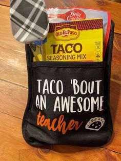 a black bag with taco bout an awesome teacher written on it