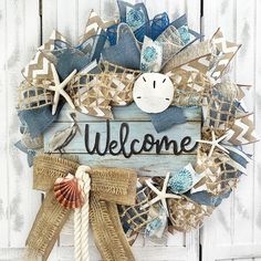 a welcome wreath with seashells and starfish