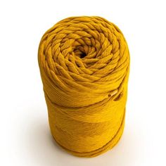 a skein of yellow yarn on a white background