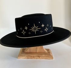 This black starlet hat is hand embroidered in Bisbee AZ and designed by Diana Dawn for Free People Cowboy Hat Design, Custom Cowboy Hats, Cowboy Aesthetic, Painted Hats, Unique Hats, Hat Ideas, Embroidered Hat, Fancy Hats, Wearing A Hat