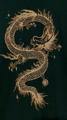 a gold dragon on a black shirt