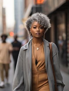 This pin celebrates the natural elegance and confidence that comes with embracing one's silver strands. From chic pixie cuts to glamorous long waves, these gray hairstyles redefine beauty at every age. Follow for more inspiring looks! Afro Grey Hair Black Women, Gray Afro Hairstyles, Pixie Haircut Grey, Grey Faux Locs Black Women, Silver Hair On Black Women, Curly Salt And Pepper Hair, Grey Box Braids Silver Black Women, Gray Natural Hair Styles Black Women, Gray Hairstyles For Black Women