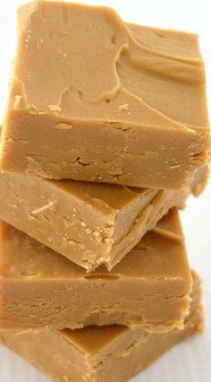 four pieces of peanut butter fudge stacked on top of each other