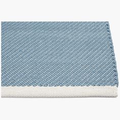 the blue and white rug is folded on top of each other, with an area for text