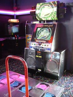 an arcade machine sitting on top of a carpet