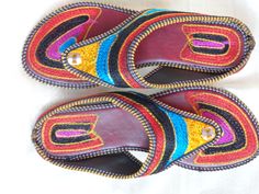 Bohemian shoes, colourful women's sandals from Punjab: Fashion footwear for the contemporary city dweller, from five centuries back. Mumtaz, the lady for whom the Taj Mahal was built probably lived in shoes and sandals much like these. Originally meant for the Maharajahs and the Maharanis [Kings and Queens and such royalty], these handcrafted fashion footwear for men and women mainly come from the villages of Punjab and Rajasthan. This period fashion piece was introduced to India during the Mugh Traditional Fair Trade Huarache Sandals For Beach, Traditional Leather Flip Flops For Festivals, Bohemian Multicolor Embroidered Sandals, Multicolor Embroidered Open Toe Sandals, Embroidered Multicolor Open Toe Sandals, Traditional Brown Toe Post Flip Flops, Traditional Fair Trade Huarache Sandals For Festivals, Traditional Handmade Brown Flip Flops, Traditional Open Toe Flip Flops For Festivals