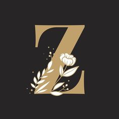 the letter z is decorated with flowers and leaves on a black background, it appears to be made up of gold foil