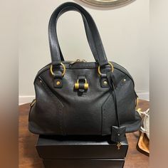 This Handbag Is A Timeless Classic!! Here Is Your Chance To Add A Fabulous Vintage Bag To Your Collection. Black With Gold Hardware No Marks On Interior. Like New Only Used A Few Times. Included In This Listing Is Ysl Muse Bag, Matching Lock/Key And Ysl Sleeper/Dust Bag. Ysl Vintage Bag, Ysl Purse Black, Ysl Muse, Ysl Black Large Bag, Vintage Black Bags With Gold-tone Hardware, Saint Laurent Bags, Locks & Key, Yves Saint Laurent Bags, Vintage Bag