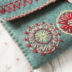 a close up of a piece of cloth with embroidered designs on it