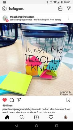 a cup with sticky notes on it sitting on top of a table