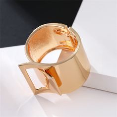 Bring a shinning finish to your favorite ensembles by decorating your wrist with this textured bangle made from a 18k gold-plated metal. 0.86" W x 2.40" diameter Hinge closure 18k gold-plated copper Party Gold-tone Metal Bangle, Gold Party Bangle With Bracelet Strap, Gold Party Bangle, Modern Gold Bangle Bracelet For Party, Educational Wall Art, Whimsical Wonderland, Bangles Making, Wide Bracelet, Head Shapes