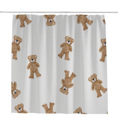 a white shower curtain with brown teddy bears on it