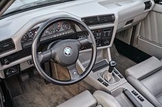 the interior of a car with dashboard and steering wheel