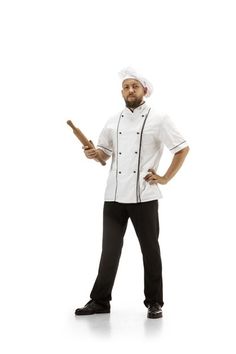 a man in a chef's outfit holding a wooden stick