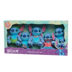 three stitch plush toys in a box