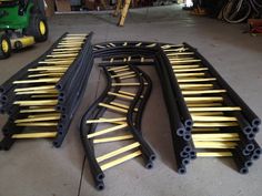 several black and yellow pieces of metal in a garage