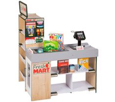 a toy cash register machine with various items on it's shelf and instructions to use the machine