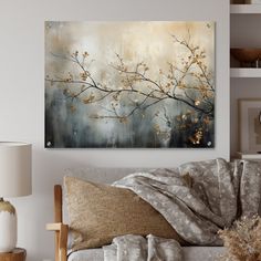 a living room scene with focus on the couch and wall art hanging above it's sofa