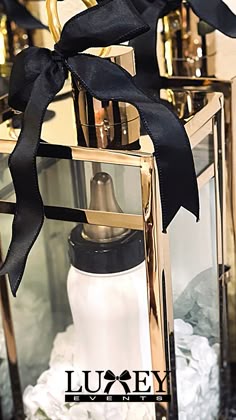 a lantern with a black ribbon tied around it