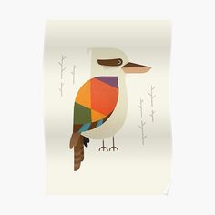 a colorful bird sitting on top of a white table next to a wall mounted art print