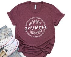 a t - shirt with the words grandma written in white on it next to jeans and sneakers