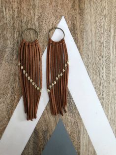 These boho earrings are the perfect addition to any outfit. Made with beautiful camel leather that will age well over time and gold details on the leather. Before shipment the earrings will be finished with 24k gold earring closures. Chic Brown Earrings For Everyday Wear, Chic Everyday Brown Earrings, Chic Brown Everyday Earrings, Handmade Brown Tassel Earrings, Handmade Brown Hoop Earrings For Everyday Wear, Brown Tassel Earrings For Festivals, Elegant Brown Adjustable Tassel Earrings, Elegant Brown Dangle Tassel Earrings, Chic Handmade Leather Jewelry