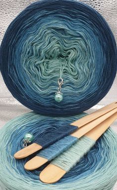 two skeins of yarn sitting on top of each other