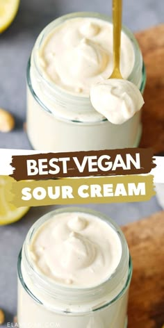 two mason jars filled with vegan cream and topped with a wooden spoon