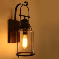 a light that is on the side of a wall with a lamp attached to it