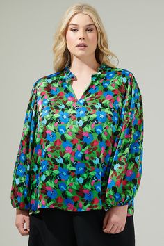 Add a pop of a colorful touch to your outfit of the day with the Destine Floral Hathaway Split Neck Long Sleeve Blouse! It features a ruffle split neckline framed by billowing balloon sleeves. The bodice maintains a relaxed fit and can be styled tucked into your favorite high waisted pants. This top is perfect for anything from day parties to dinner with friends.- Split neckline- Elastic cuffs - Lined- Balloon sleeves- Color: Green blue fuchsiaSize + Fit - Model is 5'8" and wearing size XS- Meas Green Top With Vibrant Print For Fall, Blue Blouse With Vibrant Print For Fall, Vibrant Long Sleeve Tops For Day Out, Vibrant Green Blouse For Spring, Vibrant Blue Tops For Spring, Green Long Sleeve Tops With Floral Print, Green Floral Print Blouse With Relaxed Fit, Vibrant Blue Spring Tops, Vibrant Green Fall Top