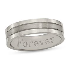 a wedding band with the word forever engraved on it's center, in silver