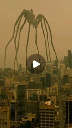 the giant spider is flying over the city