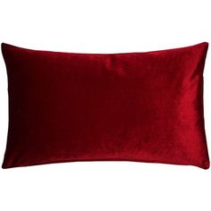 a red velvet pillow on a white background