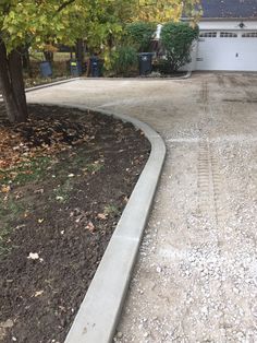 the driveway is clean and ready to be used by someone who has recently finished their driveway