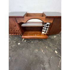 a wooden cabinet with a white and black object in it