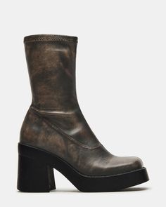 Bring a retro twist to all your looks in KLAYTON. Set on a thick platform sole, these 70s-inspired boots have a close sock-like fit and go with everything from midi skirts to floral dresses. The ultimate throwback! Stretch upper to fit most leg sizes Mid-calf shaft height Looks great with dresses and denim 3.5 inch heel height 1 inch platform 9.75 inch shaft circumference 8 inch shaft height Vegan leather upper material Textile lining Synthetic sock Synthetic sole Imported Chunky High Ankle Platform Boots For Fall, Fall Chunky High Ankle Platform Boots, Retro High Ankle Boots For Fall, Fall Mid-calf Chunky Platform Boots For Streetwear, Mid-calf Platform Boots For Fall, Retro Knee-high Platform Boots, Black Retro Platform Boots, Fall Chunky Platform High-cut Heeled Boots, Fall High Cut Chunky Platform Heeled Boots