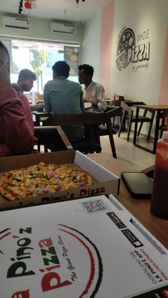 a pizza box sitting on top of a table