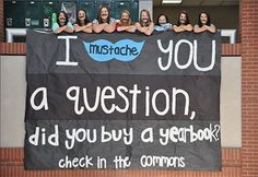 a sign that says i love you a question, did you buy a yearbook? check in the commons