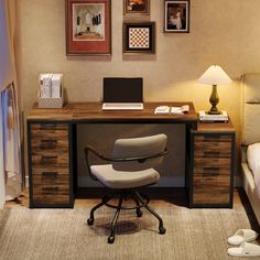 a chair sitting in front of a desk with a laptop computer on top of it